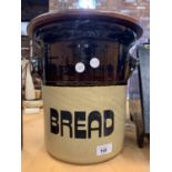 A LARGE STONEWARE BREAD BIN WITH WOODEN LID