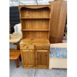 A MODERN PINE DRESSER COMPLETE WITH PLATE RACK, 31.5" WIDE