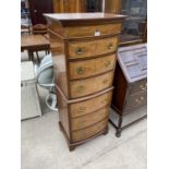 A REPRODUCTION WALNUT BOWFRONTED CHEST ON CHEST OF SIX GRADUATED DRAWERS, 21" WIDE