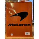 AN ORANGE METAL 'MCLAREN' PETROL CAN WITH BRASS CAP