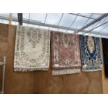 THREE PATTERNED RUGS