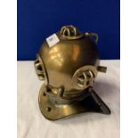 A SMALL METAL DIVERS HELMET ORNAMENT