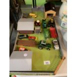 A WOODEN FARM YARD LAYOUT WITH SHEDS AND DIECAST VEHICLES TO INCLUDE A JOHN DEERE LOW LOADER WAGON