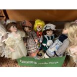FIVE PORCELAIN HEADED DOLLS TO INCLUDE A CLOWN