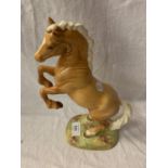 A BESWICK REARING PALOMINO HORSE