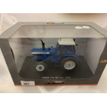 A BOXED UNIVERSAL HOBBIES DIE CAST FORD TRACTOR 1:32