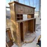 A LARGE PINE ENTERTAINMENT UNIT WITH SHELVES, CUPBOARDS WITH APPLIED BARLEYTWIST DECORATION 82"