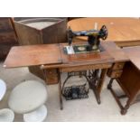 A SINGER TREADLE SEWING MACHINE