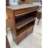 AN EARLY 20TH CENTURY GLOBE WERNIKE STYLE THREE TIER BOOKCASE, WITH CLEAR GLASS TOP SECTION,