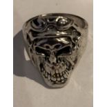 A WHITE METAL SKULL DESIGN RING