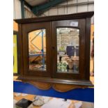 A SMALL VINTAGE WOODEN MIRRORED CORNER CUPBOARD