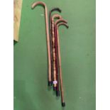 A GROUP OF FIVE WALKING STICKS INCLUDING BENTWOD