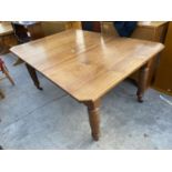 AN EDWARDIAN WIND-OUT DINING TABLE WITH CANTED CORNERS, WITH EXTRA LEAF 60x42" (FULLY EXTENDED)