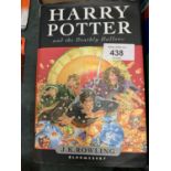 A FIRST EDITION COPY OF 'HARRY POTTER AND THE DEATHLY HALLOWS' BY J K ROWLING