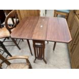 AN EDWARDIANMAHOGANY AND INLAID SUTHERLAND TABLE WITH CANTED CORNERS