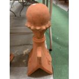 A TERRACOTTA ROOF FINIAL IN A CHESS PIECE STYLE