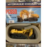 A KOMATSU 1:50 SCALE MODEL OF A PC650 HYDRAULIC EXCAVATER