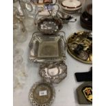 THREE SILVER PLATED BASKETS, A CRUET STAND, DISH AND SAUCEBOATS