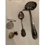 A LADLE STYLE TEA STRAINER POSSIBLY SILVER, AN EPNS TEASPOON, A GEORGE 6TH CORONATION MEDAL AND A