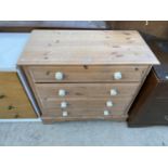 A MODERN PINE CHEST OF FOUR DRAWERS