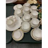AN ASSORTMENT OF WHITE DINNER WARE WITH GOLD DETAIL