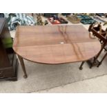 A MAHOGANY DROP LEAF DINING TABLE ON CABRIOLE SUPPORTS