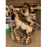 A PAIR OF LARGE DESIGNER CERAMIC REARING HORSES