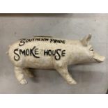 A SOUTHERN PRIDE SMOKEHOUSE CAST METAL MONEY PIG