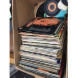 A LARGE BOX OF ASSORTED RECORDS TO INCLUDE JOHNNY CASH, BUDDY HOLLY AND ANDY WILLIAMS ETC