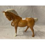 A BESWICK PALOMINO PONY