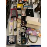 A COLLECTION OF BOXED JEWELLERY AND THREE PURSES