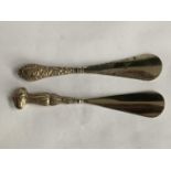 TWO SHOEHORNS WITH HALLMARKED BIRMINGHAM SILVER HANDLES 1904 AND 1911