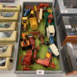 A LARGE QUANTITY OF TRACTORS AND FARM IMPLIMENTS IN A WOODEN TRAY