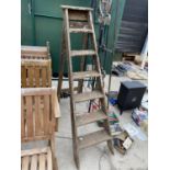 A SET OF VINTAGE WOODEN STEPLADDERS