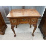 A REPRODUCTION BURR WALNUT LOW BOY OF THREE DRAWERS ON CABRIOLE LEGS, 27" WIDE