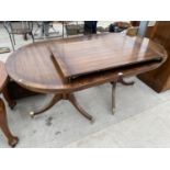 A MAHOGANY EXTENDING DINING TABLE ON TWIN PEDESTAL SUPPORTS