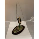 A BORDER FINE ARTS FISHERMAN FIGURINE ON A WOODEN PLINTH SIGNED D GEENTY