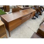 AN A.YOUNGER LIMITED RETRO TEAK SIDEBOARD 78" WIDE, ENCLOSING THREE DRAWERS AND TWO CUPBOARDS