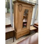 AN EARLY 20TH CENTURY LIGHT OAK MIRROR-DOOR WARDROBE WITH DRAWER TO BASE, 47" WIDE