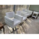 A SET OF FOUR LOTUS ADJUSTABLE (RISE & FALL) HAIR SALON STYLING CHAIRS, CREAM COLOURED ON POLISHED