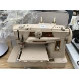 A VINTAGE SINGER SEWING MACHINE WITH CASE