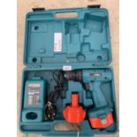 A MAKITA BATTERY DRILL WITH CHARGER AND FURTHER BATTERY BELIEVED IN WORKING ORDER BUT NO WARRANTY