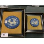 A FRAMED BLUE AND WHITE OVAL PLAQUE WITH VELVET BACKING AND A FRAMED JASPERWARE PLAQUE
