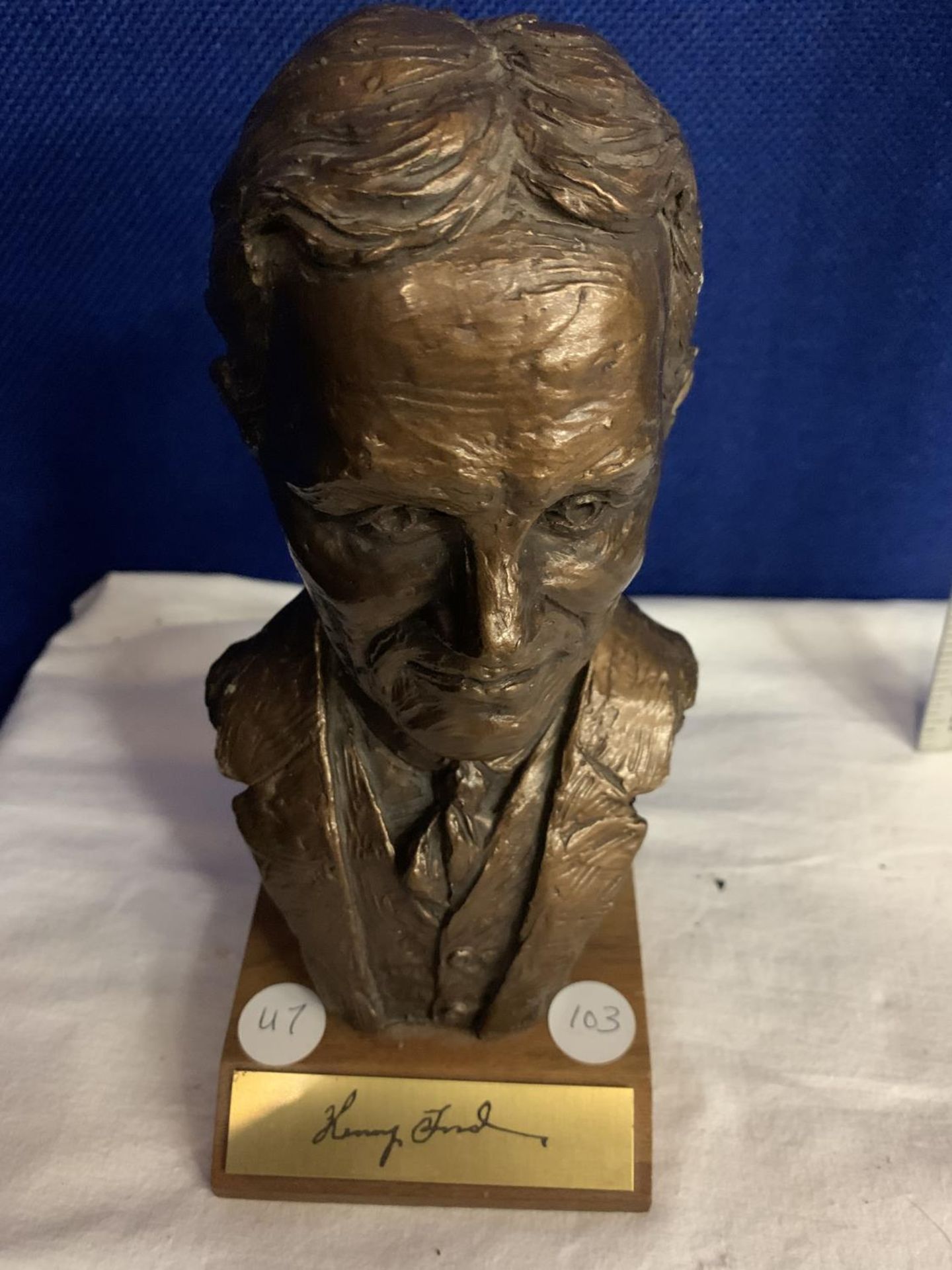 A SMALL RESIN BUST OF HENRY FORD