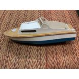 A VINTAGE WOODEN MODEL OF A SPEED BOAT