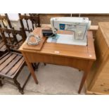 A SINGER 416 ELECTRIC SEWING MACHINE ON FREE STANDING TABLE