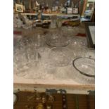 A LARGE ASSORTMENT OF CUT GLASS WARE TO INCLUDE SERVICE BOWLS AND SHERRY GLASSES ETC