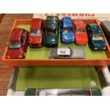 A WOODEN GARAGE WITH TOY CARS