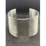 A HEAVY SILVER BANGLE