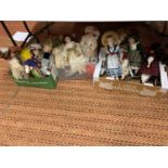 A LARGE COLLECTION OF PORCELAIN HEADED DOLLS TO INCLUDE JACK AND JILL DOLL WITH A PAIL OF WATER